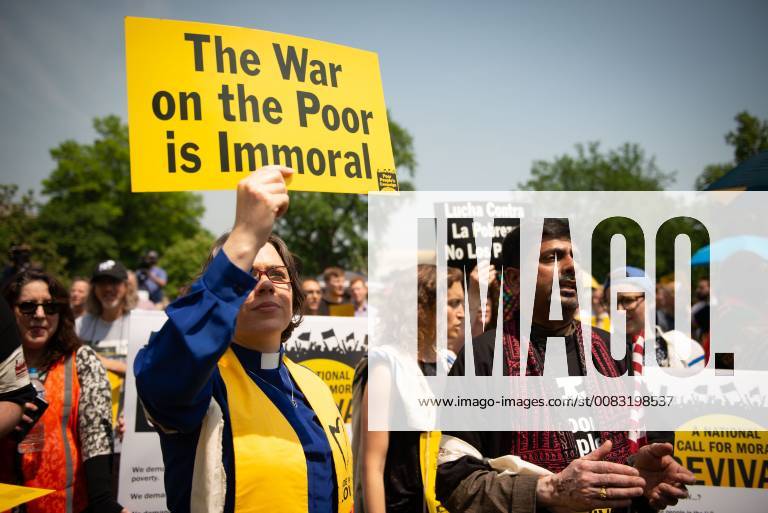 Washington, District of Columbia, U.S. - A clergy member holds a sign declaring The War on the Poor is Immoral at a rally and march at the U.S. Capitol. The campaign began with rallies in about three dozen states, and is planned to last six weeks. Approximately 200 people were arrested in the various rallies, often being cited for blocking traffic. Washington U.S. - ZUMAmj3_ 20180514_zaf_mj3_501