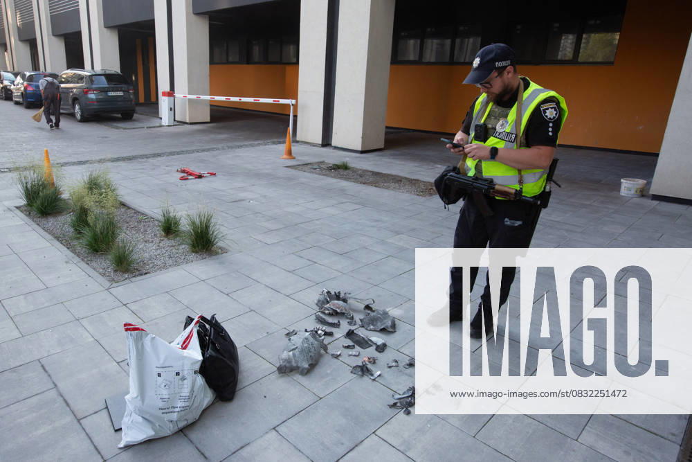 Russian drone attack in residential building of Kyiv KYIV, UKRAINE - JULY 13: A Ukrainian police officer inspects the fragments in front of the damaged residential building after Russian drone attack in Kyiv, Ukraine amid Russia-Ukraine war on July 13, 2023. Ukraine World. Editorial use only. Please get in touch for any other usage.