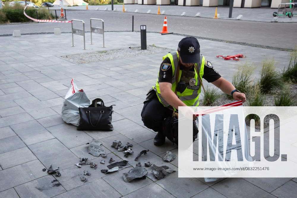 Russian drone attack in residential building of Kyiv KYIV, UKRAINE - JULY 13: A Ukrainian police officer inspects the fragments in front of the damaged residential building after Russian drone attack in Kyiv, Ukraine amid Russia-Ukraine war on July 13, 2023. Ukraine World. Editorial use only. Please get in touch for any other usage.