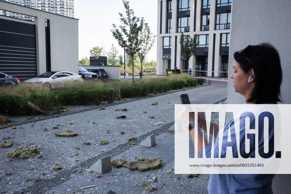 Russian drone attack in residential building of Kyiv KYIV, UKRAINE - JULY 13: A woman takes photos of the damaged residential building after Russian drone attack in Kyiv, Ukraine amid Russia-Ukraine war on July 13, 2023. Ukraine World. Editorial use only. Please get in touch for any other usage.