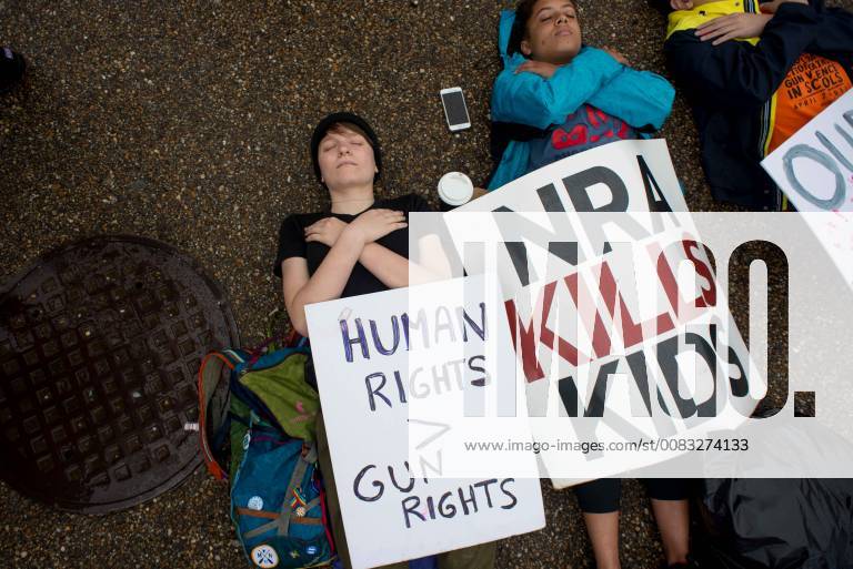 Washington, District of Columbia, U.S - Local high school students stage a lie-in in front of the White House to honor the victims of the Santa Fe High School shooting in Texas. The group is demanding the U.S. president and Congress work to pass gun control legislation. Washington U.S. - ZUMAs226 20180519_zap_s226_003