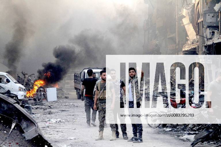 (180521) -- DAMASCUS, May 21, 2018 -- Syrian soldiers take a selfie in the Hajar al-Aswad district, south of Damascus, Syria, on May 21, 2018, just hours after it was declared free of the Islamic State (IS) militants. For the first time in seven years, Syria s capital Damascus was declared secure and empty of any rebel presence on Monday, following the defeat of the Islamic State (IS) in their last strongholds south of the capital, an achievement that closed the last chapter of war in the Syrian capital. ) SYRIA-DAMASCUS-IS-FINAL DEFEAT HummamxSheikhxAli