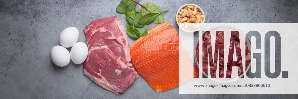 Food ingredients high in iron for health and wellness top view on grey concrete background Fresh salmon fillet, raw beef, nutritious eggs, spinach, nuts cashews and liver arranged on a gray background, iron rich foods essential for a balanced diet concept, 94607570.jpg RECORD DATE NOT STATED