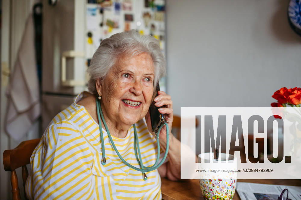 Elderly lady having phone call. Elderly lady having phone call, talking with friend. model released