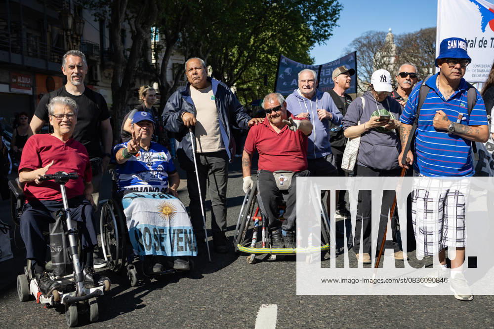 Disabled citizens and pensioners pose for the camera during a retireesâ€⠢ march against President Javier Mileiâ€⠢s austerity measures. Buenos Aires Argentina - ZUMAp265 20251001_zip_p265_003