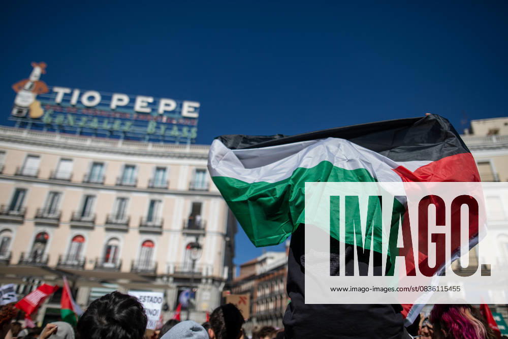 A protester raises a Palestinian flag during the demonstration. Student Union rallied under the slogan, Stop everything to stop the genocide. The students called a strike and took to the streets to protest and support the Sumud Global Flotilla. Madrid Spain - ZUMAs197 20251002_aaa_s197_131
