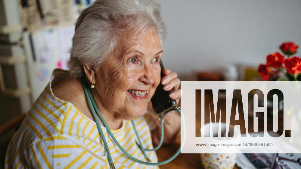 Elderly lady having phone call. Elderly lady having phone call, talking with friend. model released