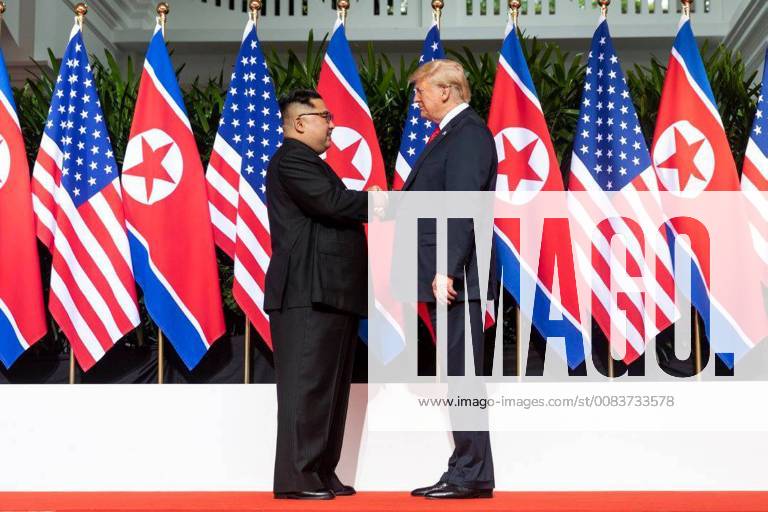 U.S. President Donald Trump shakes hands with North Korean leader Kim Jong Un on June 12, 2018, at Singapore s Capella Hotel in what is the first meeting between a sitting U.S. president and a North Korean leader. White House WAX2018061207 SHEALAHxCRAIGHEAD