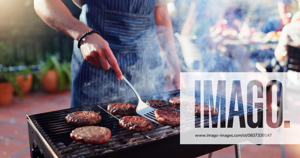 Barbecue, cooking and man with burgers outdoor backyard for meal at reunion, social event or lunch on terrace. Party, food and male person grilling patty, beef or meat for bbq dish on weekend at home Barbecue, cooking and man with burgers outdoor backyard for meal at reunion, social event or lunch on terrace. Party, food and male person grilling patty, beef or meat for bbq dish on weekend at home., model released, , property released, , 60335580.jpg RECORD DATE NOT STATED