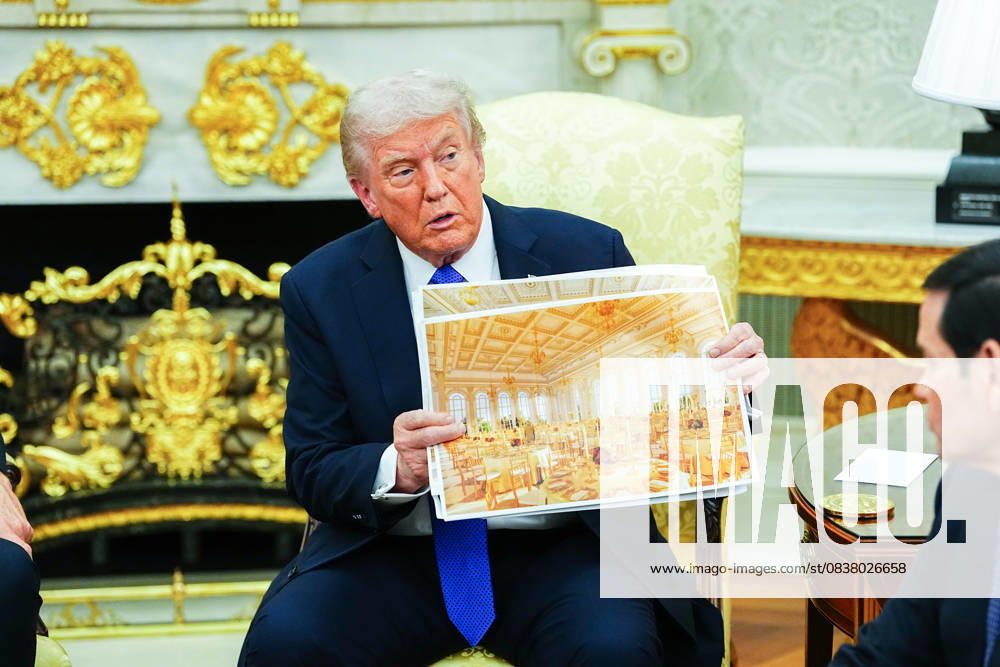 President Donald Trump shows an interior rendering of the new White House Ballroom while meeting with Secretary General of NATO Mark Rutte in the Oval Office of the White House in Washington, DC on Wednesday, October 22, 2025. The leaders are meeting to discuss continuing support for Ukraine. WASP20251022315 AaronxSchwartz