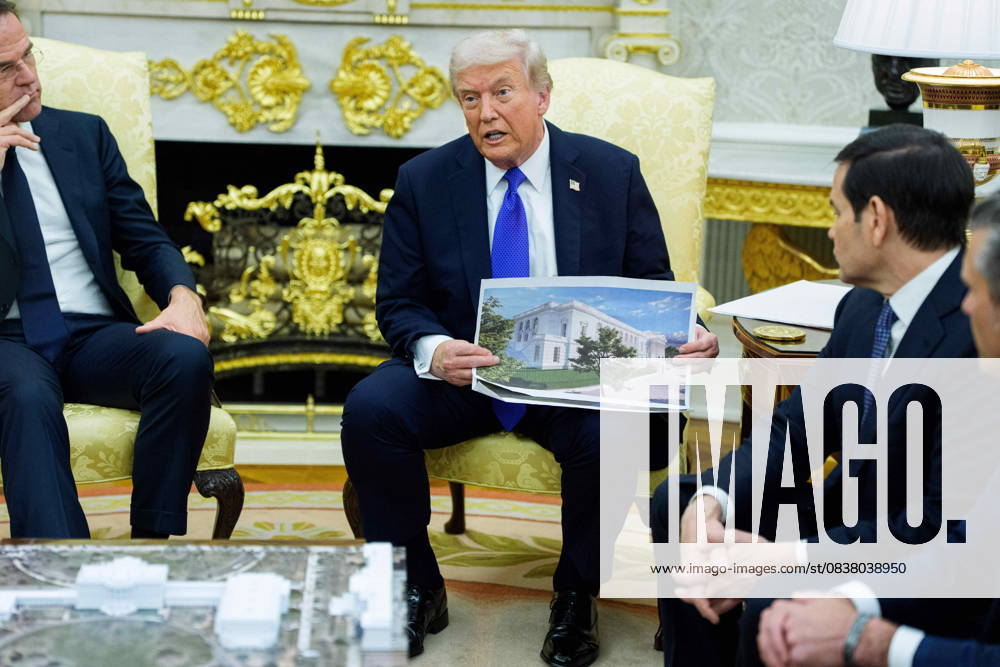 United States President Donald J Trump holds a mockup of the White House ballroom, as he meets Mark Rutte, Secretary General of the North Atlantic Treaty Organization (NATO) in the Oval Office of the White House in Washington, DC, USA, on Wednesday, October 22, 2025. The leaders are meeting to discuss continuing support for Ukraine Washington USA - ZUMAutte 20251022_faa_s152_065