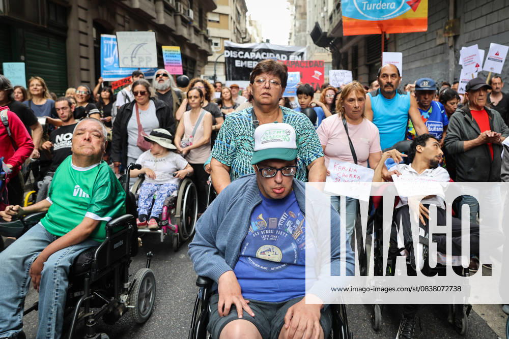 People with disabilities and healthcare professionals marched to the National Ministry of Health to protest the governmentâ€⠢s failure to implement the Disability Emergency Law. Buenos Aires Argentina - ZUMAp265 20251022_zip_p265_003