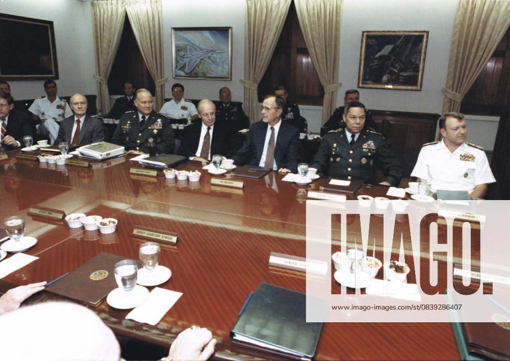 United States President George H.W. Bush meets with his military advisors in the Pentagon Gold Room at the Pentagon in Washington, D.C., the usual meeting place of the Joint Chiefs of Staff, on August 15, 1990 to discuss the U.S. military response to the Iraqi invasion of Kuwait. From left to right: White House Chief of Staff John Sununu; National Security Advisor Brent Scowcroft; General H. Norman Schwarzkopf, U.S. Army, Commander-in-Chief U.S. Central Command; U.S. Secretary of Defense Dick Cheney; President Bush; Chairman, Joint Chiefs of Staff Colin E. Powell; and Vice Chairman, Joint Chiefs of Staff, Admiral David E. Jeremiah, U.S. Navy..Mandatory Credit: DoD via CNP Washingto - ZUMAs152 19900807_faa_s152_001