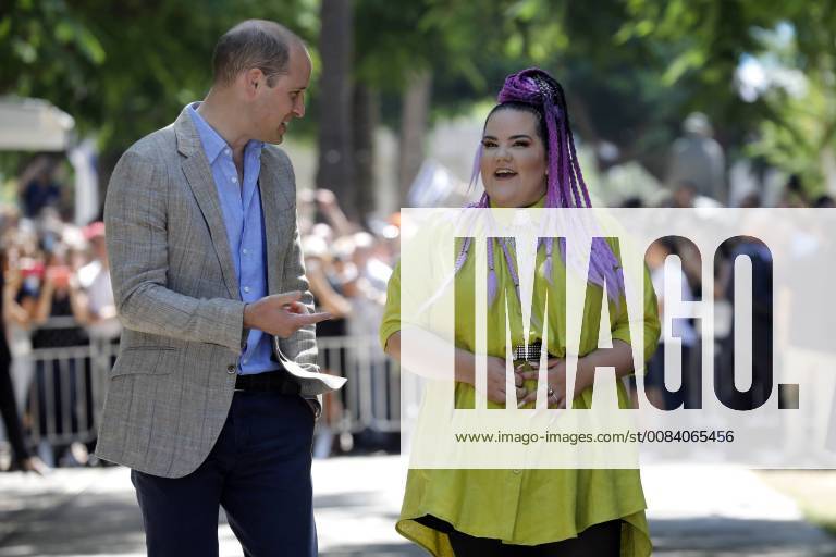 Britain s Prince William speaks with Israeli 2018 Eurovision song contest winner Netta Barzilai during a tour of Rothschild Boulevard, in Tel Aviv, Israel, June 27, 2018. The Duke of Cambridge is the first member of the royal family to make an official visit to the Jewish state and the Palestinian territories. Pool JERX20180627105 AMIRxCOHEN