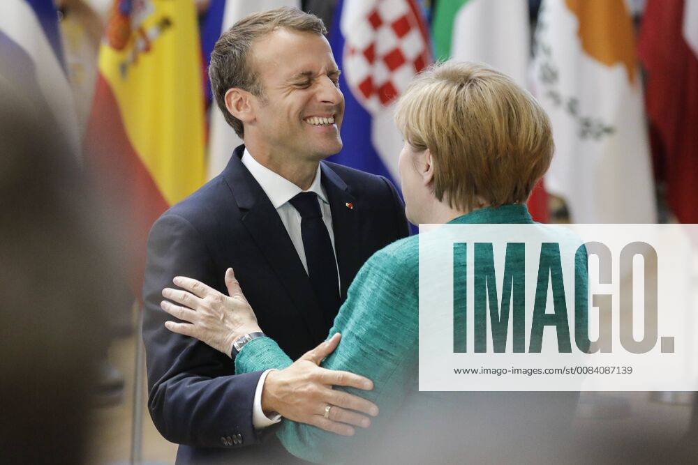 President of France Emmanuel Macron and Chancellor of Germany Angela Merkel arrive for an EU summit meeting, Thursday 28 June 2018, at the European Union headquarters in Brussels. THIERRYxROGE 05373680