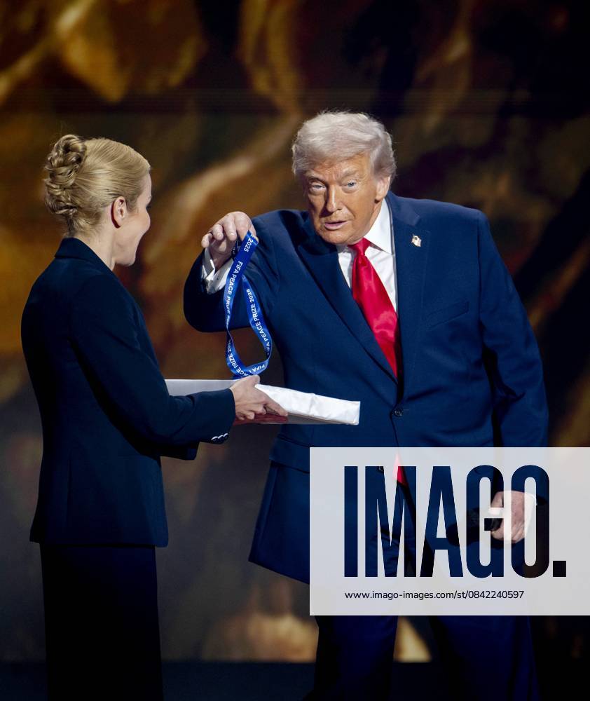 WASHINGTON - President Donald Trump receives the FIFA Peace Prize from FIFA President Gianni Infantino during the draw for the 2026 World Cup in the United States. ANP KOEN VAN WEEL netherlands out - belgium out