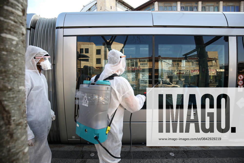 Coronavirus precautions in Jerusalem JERUSALEM - MARCH 16: Officials carry out disinfection works as a precaution against the coronavirus (COVID-19) at a tram station in Shuafat district in Jerusalem on March 16, 2020. Kudüs Palestinian Territory, Occupied. Editorial use only. Please get in touch for any other usage.