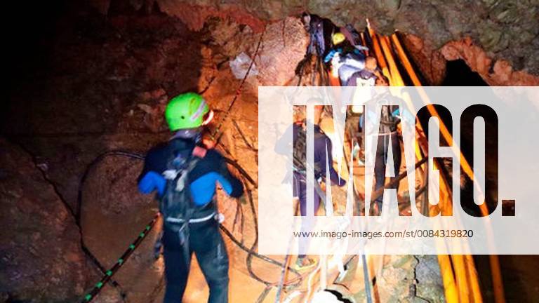 Mae Sa, Thailand - Thai rescue team members walk inside a cave where 12 boys and their soccer coach have been trapped since June 23, in Mae Sai, Chiang Rai province, northern Thailand. The local governor in charge of the mission to rescue them said Saturday that cooperating weather and falling water levels over the last few days had created appropriate conditions for evacuation, but that they won t last if it rains again. Photo released by on Saturday, July 7, 2018, Mae Sa Thailand - ZUMAz03_ 20180707_sha_z03_599