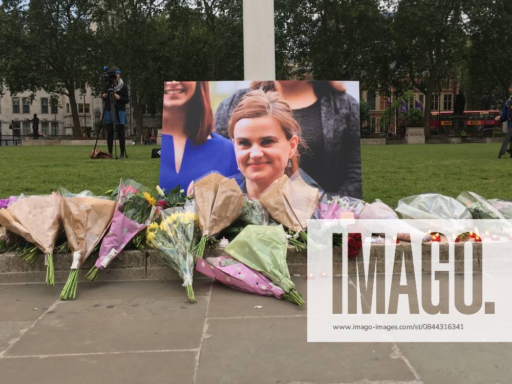 British politics reeling from shock of MP s murder LONDON, UNITED KINGDOM - JUNE 17: Flowers and candles left outside Britain s House of Parliament for Jo Cox, the Labour Party lawmaker who was killed on the street in her electoral district on Thursday, in London, England on June 17, 2016. London, City of Ingiltere. Editorial use only. Please get in touch for any other usage.