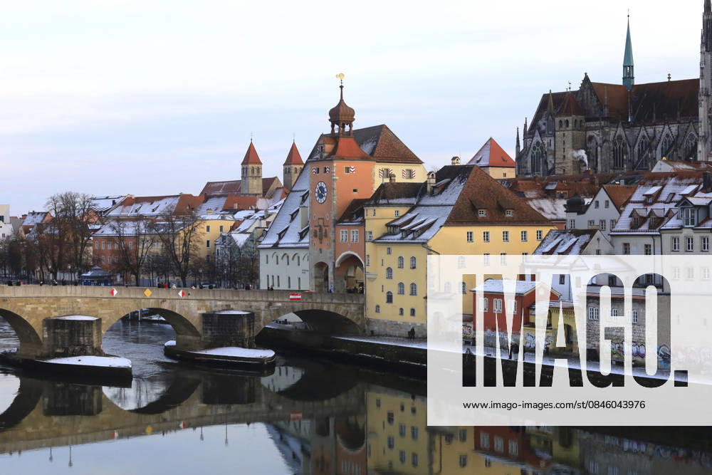 Regensburg old town and stone bridge reflected in winter river scene, JTF02652