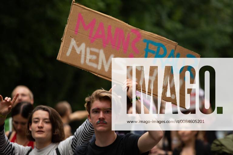 Munich: SlutWalk 2018 Protestor holds sign saying Man? Woman? Human!!! Some 500 people demonstrated through the streets of Munich to protest against sexism, rape and sexual harassment. The Slut Walk is a yearly held demonstration all over the world protesting against slut blaming and victim blaming. Munich Bavaria Germany Glockenbachviertel AlexanderxPohl