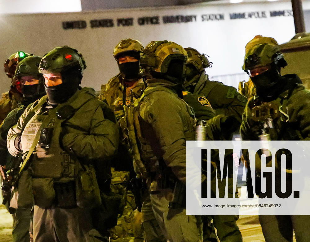 A group of less than 30 people consisting of as many Press as Protestors holding a â€oeNoise Protest†outside the Home 2 Hilton Hotel near the University of Minneapolis because they got wind some ICE agents were staying there in an neighborhood heavy with young college students were met with and vastly out numbered by aggressive ICE agents and Federal Bureau of Corrections agents in full tactical attack gear. The one in charge violently pushed a Photojournalist to the ground who was filming an arrest of his friend, a former CNN correspondent; threatened and blinded another photographer with flashlights and headlights, and mocked all the media there, showing shocking rudeness and unprofessiona - ZUMAk144 20260125_znp_k144_044