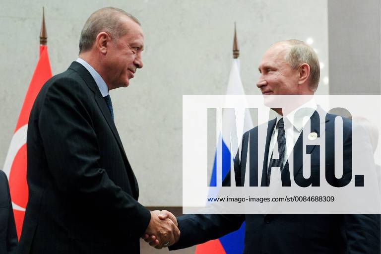 JOHANNESBURG, SOUTH AFRICA – JULY 26, 2018: The President of Turkey, Recep Erdogan (L), and the President of Russia, Vladimir Putin, shake hands during a meeting at the 10th BRICS Leaders Summit. Vladimir Astapkovich RIA Novosti TASS TS08AD0B
