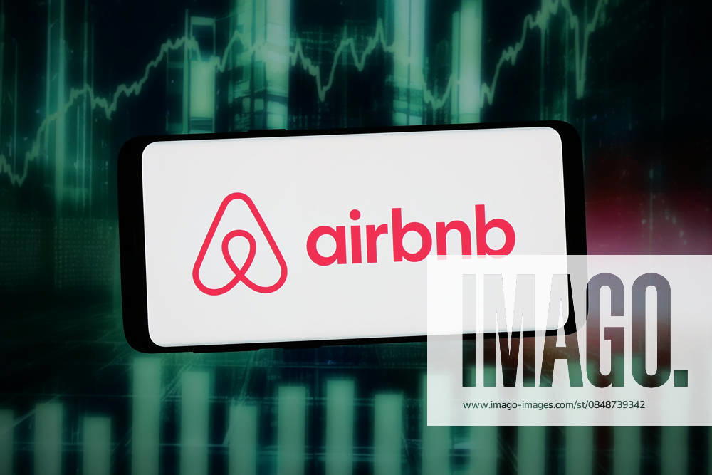 Photo illustration in Germany - 13 Feb 2026 In this photo illustration, the logo of US homestay marketplace company Airbnb Inc. is displayed on a smartphone in front of abstract background on computer screen. Germany