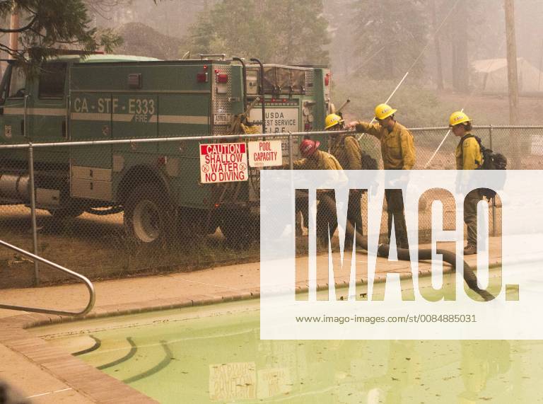 Dardnelle, California, U.S.A - U.S. Forest Service, Stanislaus HotShots crews refuel their water from a pool at Camp Jack Hazard as they work to prepare for a back burn in the Monday, Aug. 6 2018. The Donnell Fire in Tuolumne County has grown to 11,074 Acres according to the U.S. Forest Service. Dardnelle U.S.A - ZUMAbk2_ 20180806_zaf_bk2_015