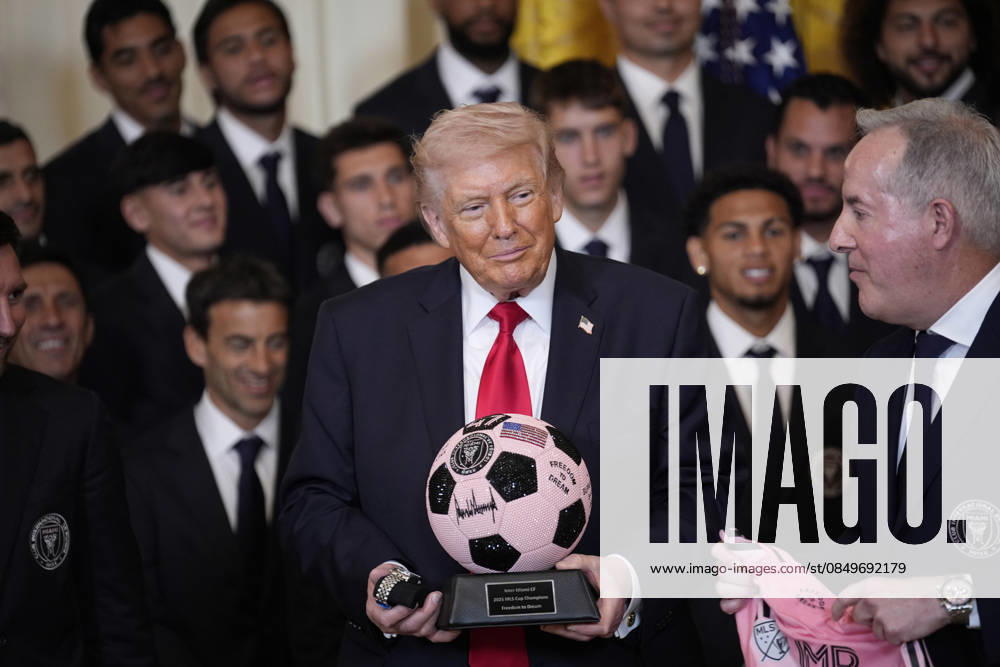 US President Donald Trump holds a soccer ball presented to him by the captain Lionel Messi during an event in the East Room of the White House on Thursday, March 5, 2026 in Washington, DC. WAX202603059897 YurixGripas