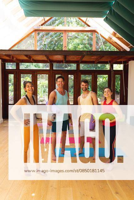 Portrait of happy multiracial male and female friends with exercise mats in yoga studio Portrait of happy multiracial male and female friends with exercise mats in yoga studio. healthy lifestyle and fitness., model released, , property released, Cape Town, South Africa, 30.10.2021, 3085649.jpg, people,portrait,happy multiracial,male female,friend,exercise mat,yoga studio,healthy lifestyle,fitness,exercise,workout,fit,athlete,training,young,sport,active,gym,adult,athletic,person,attractive,face,lifestyle,body,happy,pretty,smile,cute,multiracial,male,female,mat,yoga,studio,healthy Young Adult,Woman,Female,Mixed-Race,Man,Male,Caucasian,Mid Adult