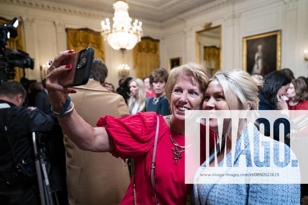 Trump Hosts Women s History Month Event Karoline Leavitt, White House press secretary, poses for a selfie photograph with an attendee during a Women s History Month event in the East Room of the White House in Washington, DC, USA, on Thursday, March 12, 2026. Every year, March is designated Women s History Month by presidential proclamation. Credit: CNP AdMedia Washington District of Columbia United States of America