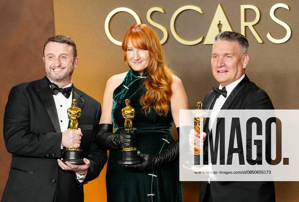 Mike Hill, Cliona Furey, and Jordan Samuel celebrate in the press photo room after winning the Makeup and Hairstyling Oscar for Frankenstein during the 98th annual Academy Awards in the Hollywood section of Los Angeles on Sunday, March 15, 2026. Conan O Brien is hosting the Oscars for the second consecutive year. LAP20260315337 BONNIExCASH