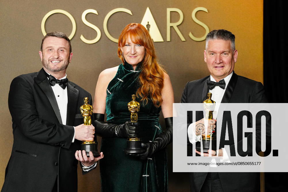 Mike Hill, Cliona Furey, and Jordan Samuel celebrate in the press photo room after winning the Makeup and Hairstyling Oscar for Frankenstein during the 98th annual Academy Awards in the Hollywood section of Los Angeles on Sunday, March 15, 2026. Conan O Brien is hosting the Oscars for the second consecutive year. LAP20260315338 BONNIExCASH