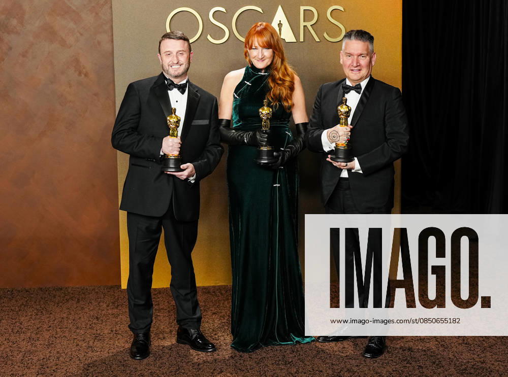 Mike Hill, Cliona Furey, and Jordan Samuel celebrate in the press photo room after winning the Makeup and Hairstyling Oscar for Frankenstein during the 98th annual Academy Awards in the Hollywood section of Los Angeles on Sunday, March 15, 2026. Conan O Brien is hosting the Oscars for the second consecutive year. LAP20260315339 BONNIExCASH