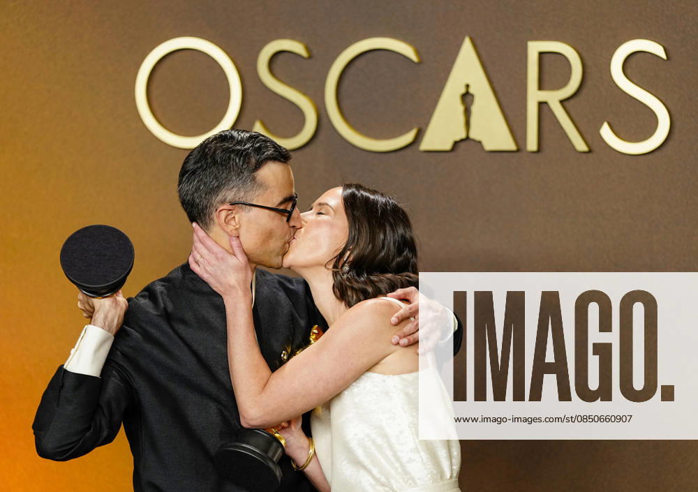 Natalie Musteata and Alexander Singh exchange a kiss during celebrations in the press photo room after winning the Best Live Action Short Film Oscar for Two People Exchanging Saliva during the 98th annual Academy Awards in the Hollywood section of Los Angeles on Sunday, March 15, 2026. Conan O Brien is hosting the Oscars for the second consecutive year. LAP20260315350 BONNIExCASH