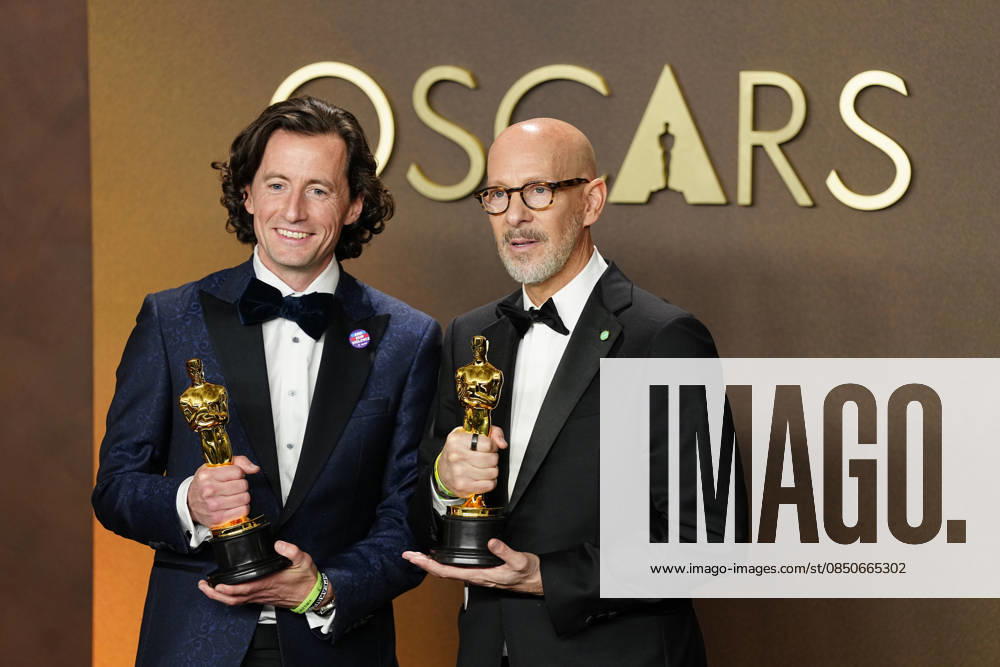 Conall Jones and Joshua Seftel celebrate in the press photo room after winning the Best Documentary Short Film Oscar for All the Empty Rooms during the 98th annual Academy Awards in the Hollywood section of Los Angeles on Sunday, March 15, 2026. LAP20260315371 BONNIExCASH