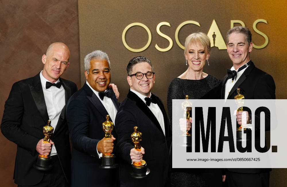Gareth John, Al Nelson, Gwendolyn Yates Whittle, Gary A. Rizzo, and Juan Peralta celebrate in the press photo room after winning the Best Sound Oscar for F1 during the 98th annual Academy Awards in the Hollywood section of Los Angeles on Sunday, March 15, 2026. LAP20260315383 BONNIExCASH