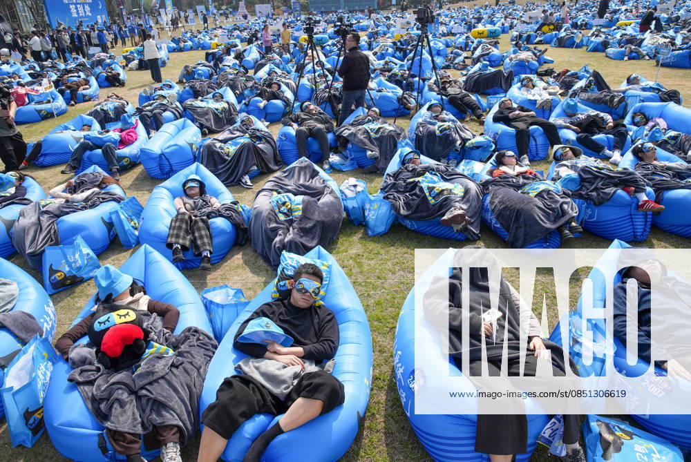 Participants fall asleep on the outdoor lawn in the Sleep King challenge to mark World Sleep Day on March 21, 2026 in Deqing County, Huzhou City, Zhejiang Province of China.