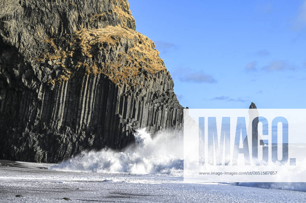 Nature’s Geological Archive: Iceland VIK, ICELAND - MARCH 11: Waves hit the black sand beach along Iceland’s southern coast, with a sea stack rising off the shoreline in Iceland on March 11, 2026. Iceland, located along the boundary between the Eurasian and North American tectonic plates and often described as the Land of Fire and Ice, is known for its volcanic activity and glacial landscapes. The island nation in the North Atlantic stands out for its dynamic terrain shaped by intense volcanic activity and glacial formations, offering significant opportunities for both scientific research and nature tourism. Black sand beaches formed by lava meeting the ocean, along with basalt columns, sea caves and isolated rock formations rising off th