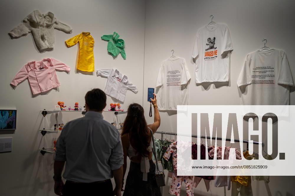HONGKONG-ART ART-BASEL People viewing cloths hanging on the wall at Art Basel 2026 in Hong Kong, March 26, 2026. NEXPHER Vernon Yuen HONG KONG