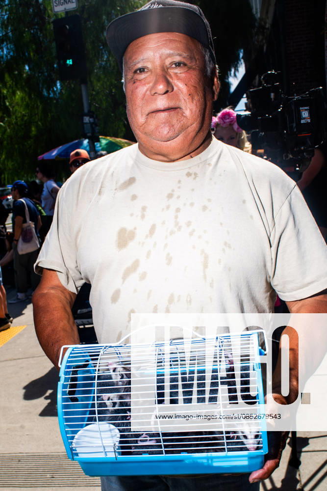 A man holds a crate of baby possums during the yearly Blessing of the Animals at Olvera Street on Saturday, April 4, 2026 in Los Angeles, California. Los Angeles USA - ZUMAh206 20260404_znp_h206_004