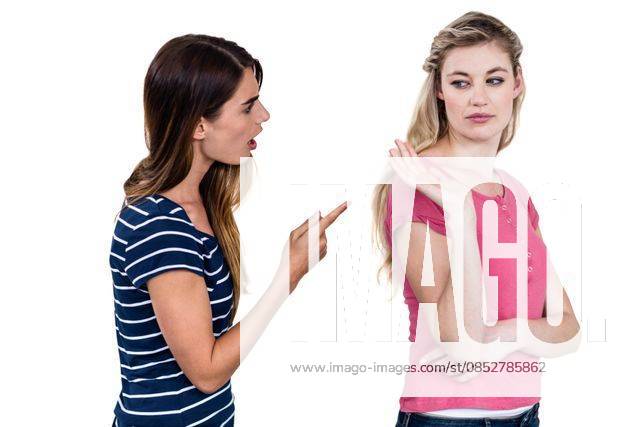 Female friends arguing Female friends arguing while standing over white background, model released, Cape Town, South Africa, 20.11.2015, 684916.jpg, casual clothing, pointing, friend, friendship, standing, isolated, cut out, annoyed, argument, fight, distant, angry, irritated, problems, troubles, unhappy, upset, serious, stern, unsmiling, frowning, dispute, disagreement, quarreling, fighting, relationship difficulties, arguing 20s, Young Adult, Woman, Female, Caucasian, 20-24 Years, Young Women, Caucasian Ethnicity Studio shot,Three Quarter Length,White background