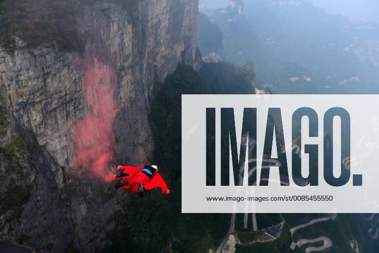 (180914) -- ZHANGJIAJIE, Sept. 14, 2018 -- A wingsuit flyer glides through the air during a wingsuit flying competition held at the Tianmen Mountain scenic spot in Zhangjiajie, central China s Hunan Province, Sept. 14, 2018. ) (sxk) CHINA-HUNAN-ZHANGJIAJIE-WINGSUIT FLYING (CN) ZhouxGuoqiang