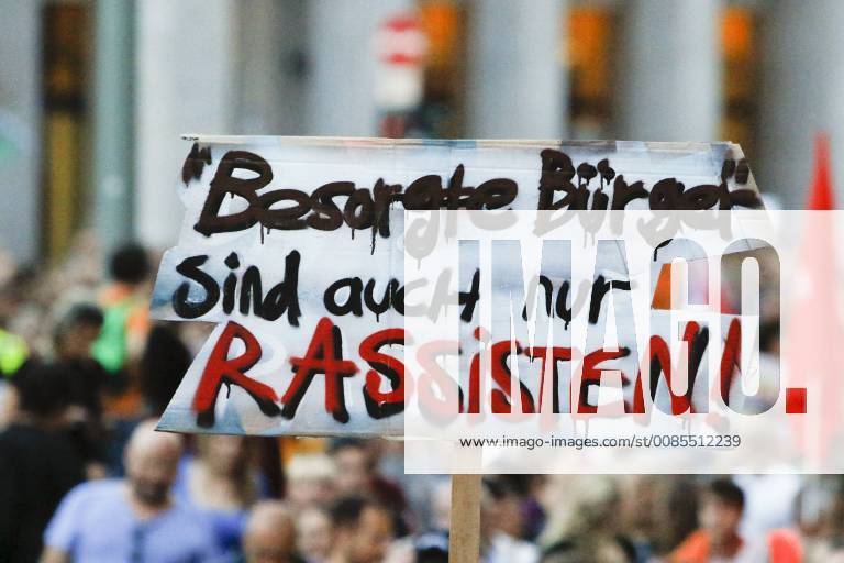 Germany: Anti-Seehofer rally in Frankfurt A protester holds up a sign that reads Concerned citizens are only racists . Around 6.300 protesters marched through Frankfurt, in support of the Seebrucke (Sea Lift) movement for the rescuing of refugees from the Mediterranean Sea. They also protested against the restrictive refugee policies of German Federal Interior Minister Horst Seehofer, who was due to speak at a congress in Frankfurt the following day, but whose appearance was cancelled. Frankfurt Hesse Germany MichaelxDebets