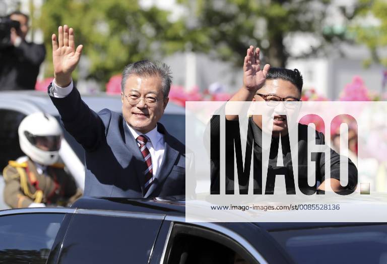 Pyeongyang, NORTH KOREA - Sep 18, 2018-Pyeongyang, North Korea-South Korean President Moon Jae In and North Korean Leader Kim Jong Un Motorcade parade at Downtown in Pyeongyang, North Korea. The South and North Korean heads of state left Pyeongyang International Airport in separate limousines (as part of a motorcade), exiting their vehicles in front of the Three Revolutions Exhibition Hall to greet Pyeongyang citizens. They then got into the same open top limousine and proceeded in a car parade. After turning left at the Yongheung intersection, the two leaders traveled while waving to the Pyeongyang citizens lining the streets until they reached Yeomyeong Street. JOINT PRESS CORP PHOTO Pyeongyang NORTH KOREA - ZUMAr168 20180918_zap_r168_246