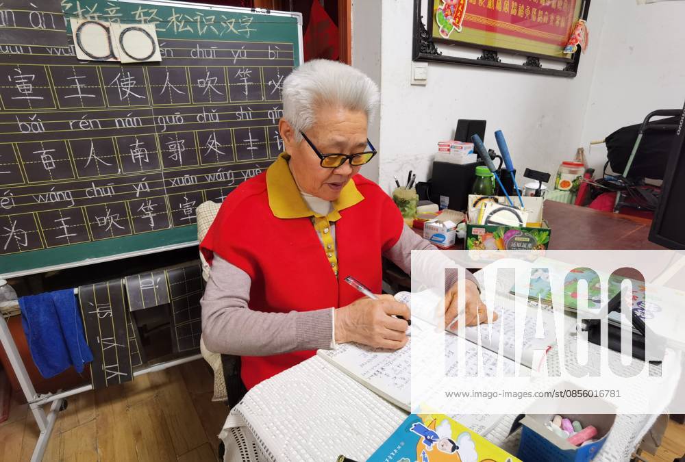 (260508) -- HUAINAN, May 8, 2026 -- Yang Weiyun, a retired Chinese primary school teacher, prepares her lessons at home in Huainan, east China s Anhui Province, April 16, 2026. TO GO WITH Feature: A Chinese classroom at the edge of the algorithm ) CHINA-ANHUI-HUAINAN-RETIRED TEACHER-LESSONS (CN) ZhuxQing