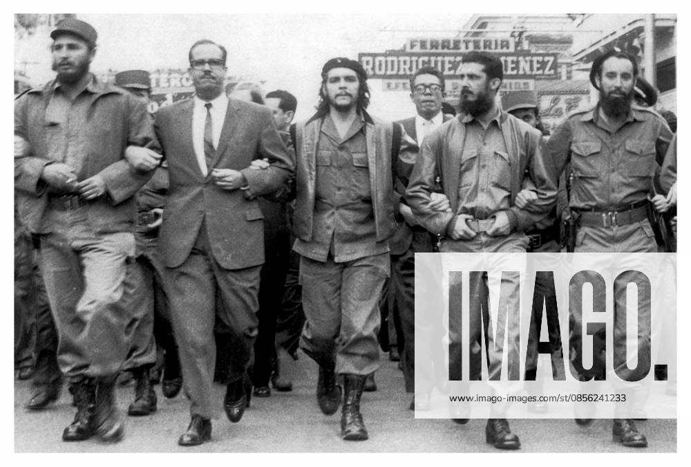 Photograph of Fidel Castro and Osvaldo Dorticós Fidel Castro Left next to Osvaldo Dorticós (President of Cuba from 1959 until 1976) with Che Guevara at a 1959 parade in Havana. Editorial use only. All other uses to be cleared with the copyright owner (World History Archive), in advance., WHA_061_0027.jpg, Fidel Castro; Osvaldo Dorticós; Che Guevara; 1959 parade; Havana; Cuba; President of Cuba; historical figures; Cuban revolution; political leaders; 1950s; Latin America; communism; socialism; revolutionaries; military parade; iconic image; Cuban history; Cuban government; Cuban politicians; Cuban leaders; Cuban culture; Cuban society; Cuban independence; Cuban nationalism; Cuban heroes; Cuban icons; Cuban flag; Cuban