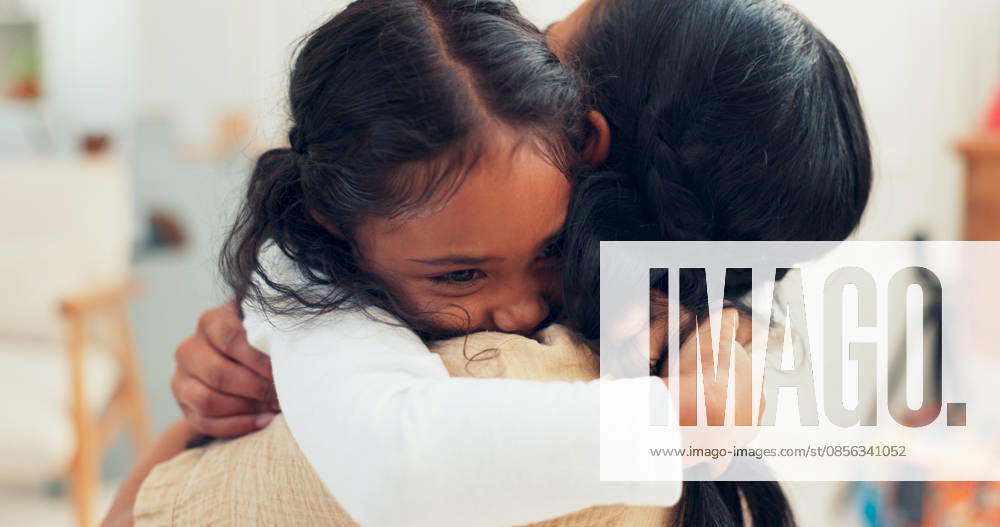 Psychologist, child and hug with therapy for mental health in clinic with communication, discussion and happy. Therapist, girl and consultation with embrace, listening and treatment in office. (License=RF) ,model released, Symbolfoto