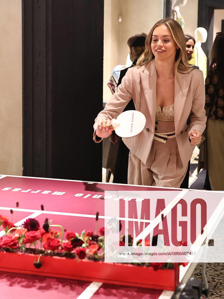 IPA84680176 - Rome, Laila Hasanovic attends the Antonio Marras boutique event. Pictured: Laila Hasanovic plays ping pong.